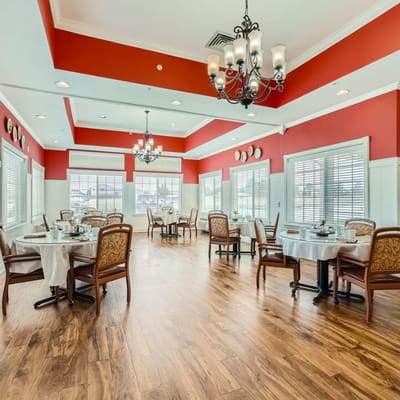 Elegant dining room with tables set for meals