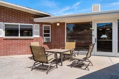 Outdoor seating area with tables and chairs