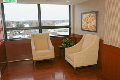 Seating area with chairs and a table by a window