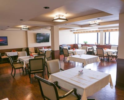 Interior dining room with tables set for meals