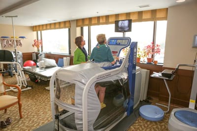 Residents engaging in therapy exercise in a rehabilitation room