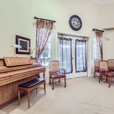 Interior common area with piano and seating
