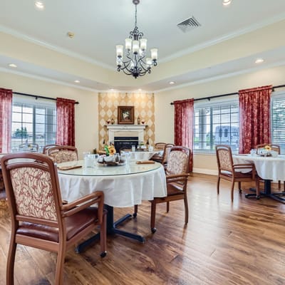 Bright dining area with well-set tables and chairs