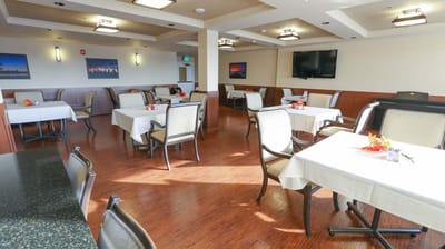 Bright dining area with tables set for meals