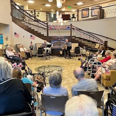 Residents enjoying live music performance in a common area