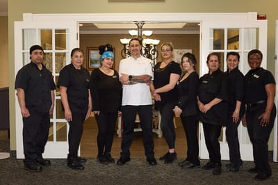 Staff posing in the common area of the facility
