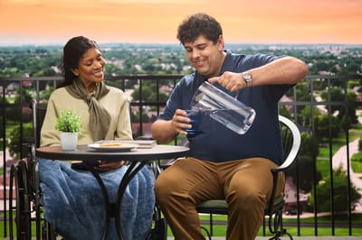 Residents enjoying a refreshing drink on a patio