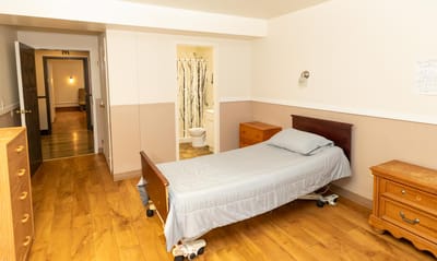 Private resident room with a bed and furniture