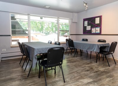 Interior view of a common area with tables and chairs