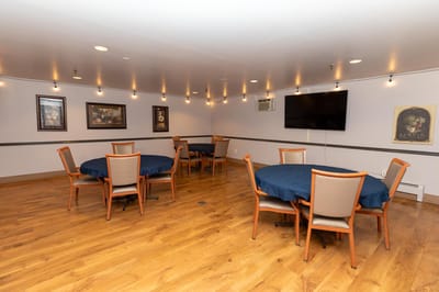 Interior view of a common area with tables and chairs