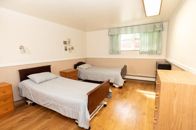 Interior view of a shared resident room with two beds