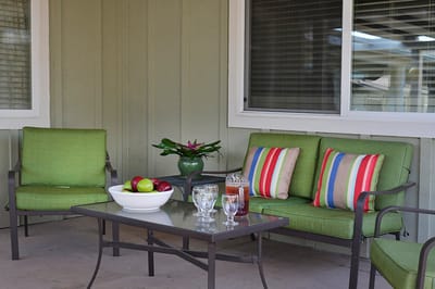 Outdoor seating area with refreshments and fruits