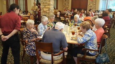 Residents enjoying a meal in the dining room
