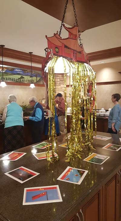 Residents enjoying an activity in a facility interior