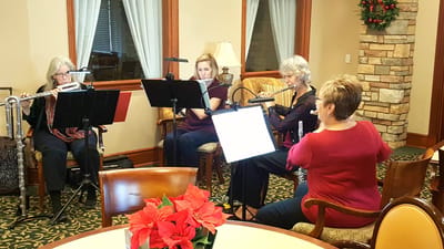 Residents enjoying a music performance in a common area