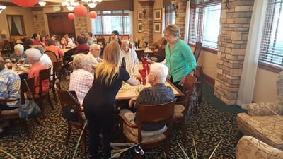 Residents dining together in a common area