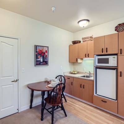 Cozy kitchen area with a dining table and artwork