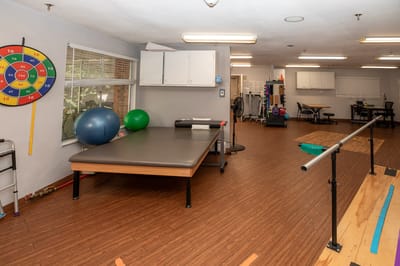 Physical therapy room with equipment and exercise area
