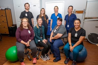 Group of staff members in a therapy room