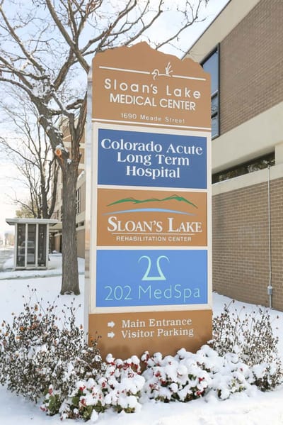 Sign for Sloan's Lake Rehabilitation Center in snowy conditions