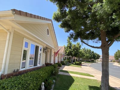 Exterior view of a senior living facility with walking paths