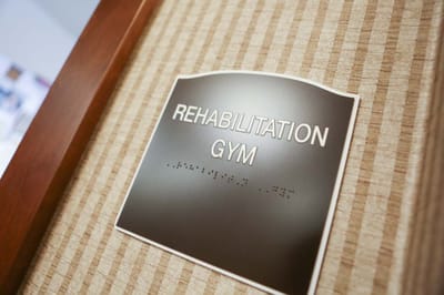 Sign indicating rehabilitation gym location