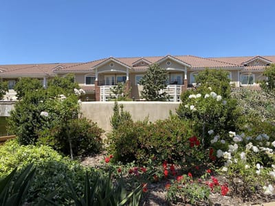 Exterior view of the facility with landscaped garden