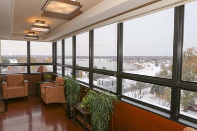Bright interior common area with large windows and seating