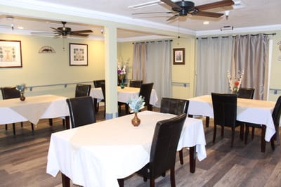 Dining room with tables set for meals