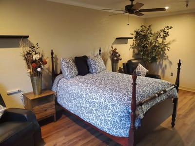 Cozy resident room with a bed and seating area