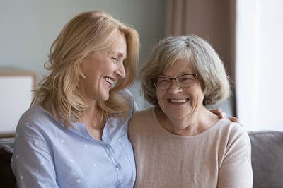 Two women enjoying a joyful moment together