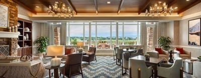 Bright and inviting common area with seating and large windows