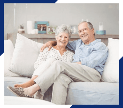 Happy couple sitting together on a couch
