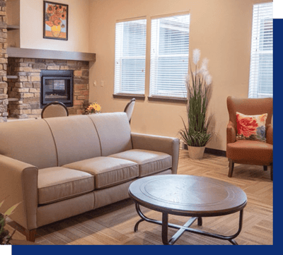 Cozy common area with a fireplace and seating