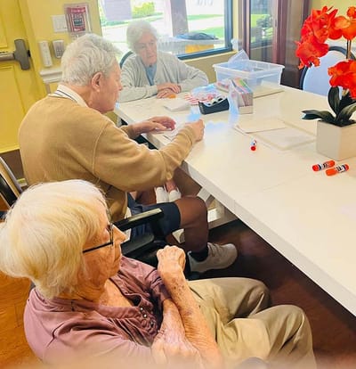Residents engaged in an arts and crafts activity indoors
