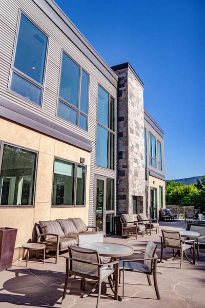 Outdoor lounge area with seating and building exterior