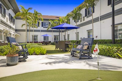 Outdoor courtyard area with seating and umbrellas