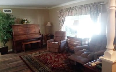 Cozy common area with seating and piano