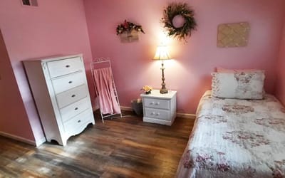 Cozy private room with a floral theme and wooden floor