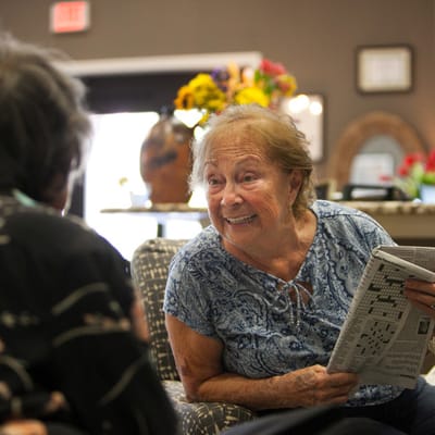 Residents engaged in conversation in a common area