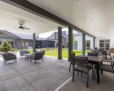 Outdoor seating area with tables and chairs