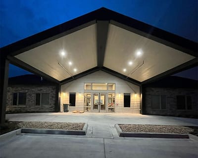 Front entrance of a senior living facility at night