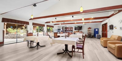 Bright common area with tables and seating
