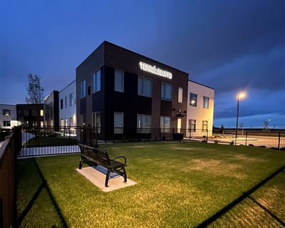 Exterior view of Terra Bluffs facility at night