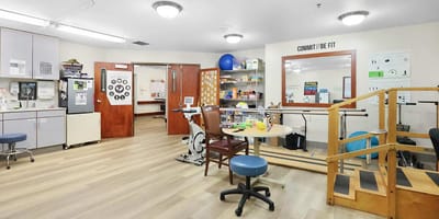 Rehabilitation area with therapy equipment and activity supplies