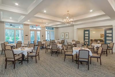 Dining room setup with tables and chairs