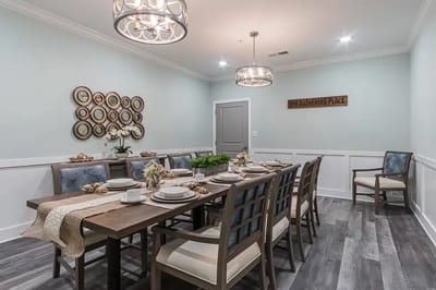 Elegant dining area with a large wooden table and decor