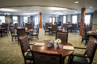 Empty dining room with round tables and chairs