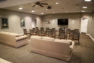 Common area layout with seating and a TV