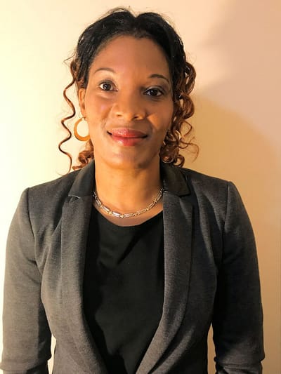 Professional portrait of a woman with curly hair